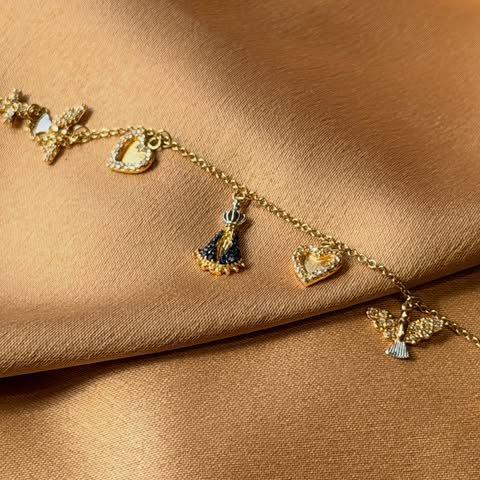 Pulseira de berloques em ouro 18k
